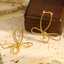 Gold Stainless Steel Wire Bow Earrings thumbnail 1