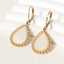 Boucles d'oreilles en acier inoxydable créoles coquillage blanc thumbnail 1