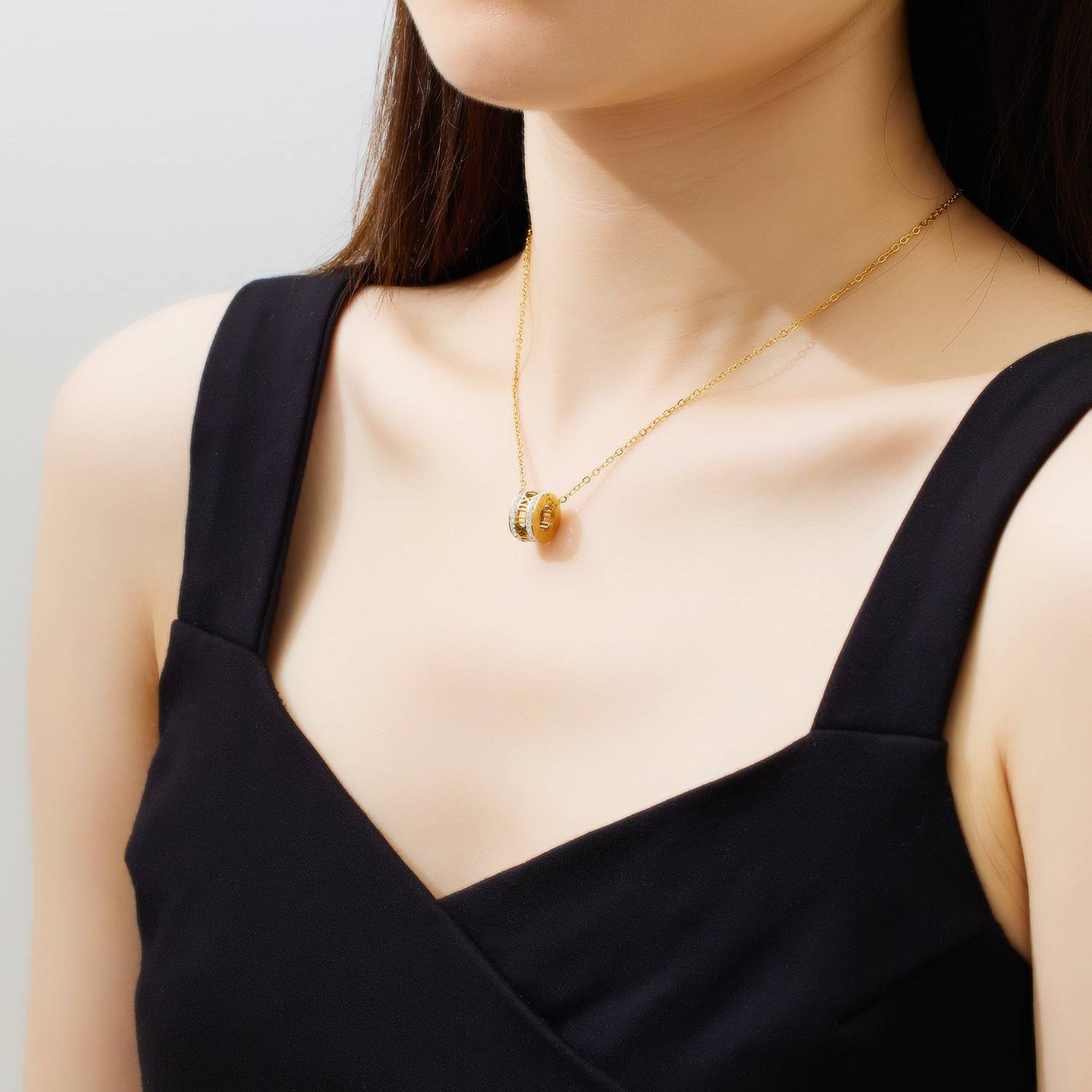 Stainless steel Roman numeral necklace plated with 18K gold: A versatile piece of jewelry with a touch of understated luxury.