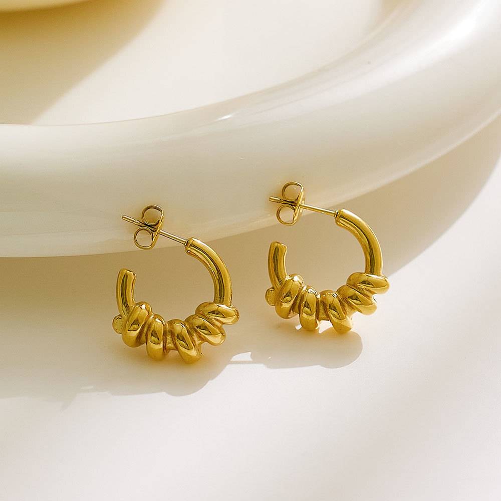 Stainless steel twist fashion fine jewelry earrings, custom retro women's clothing designer gold fine jewelry earrings